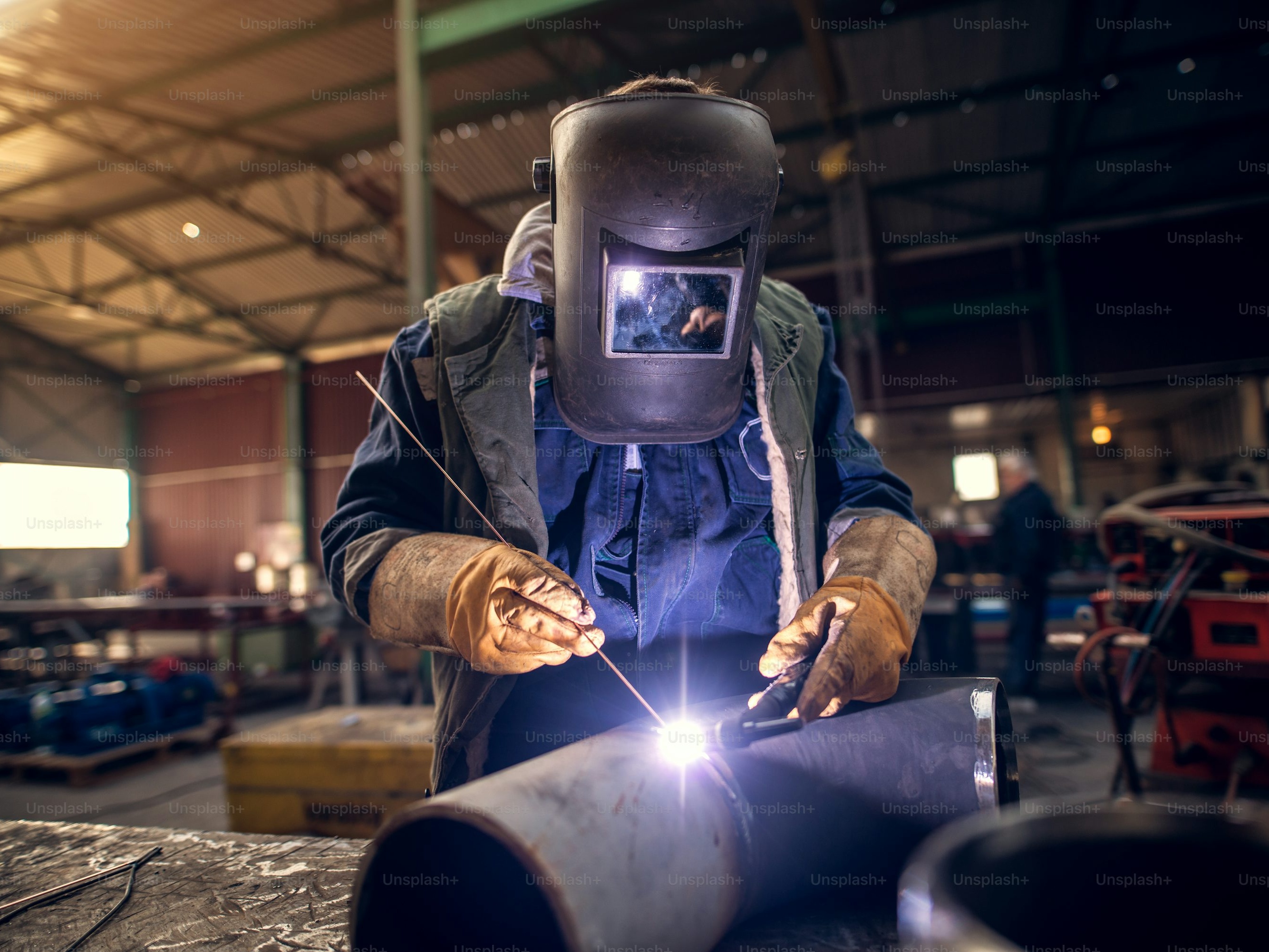 Professional tradesperson working with industrial equipment